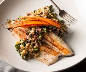 Sauteed trout filet with grains and carrots